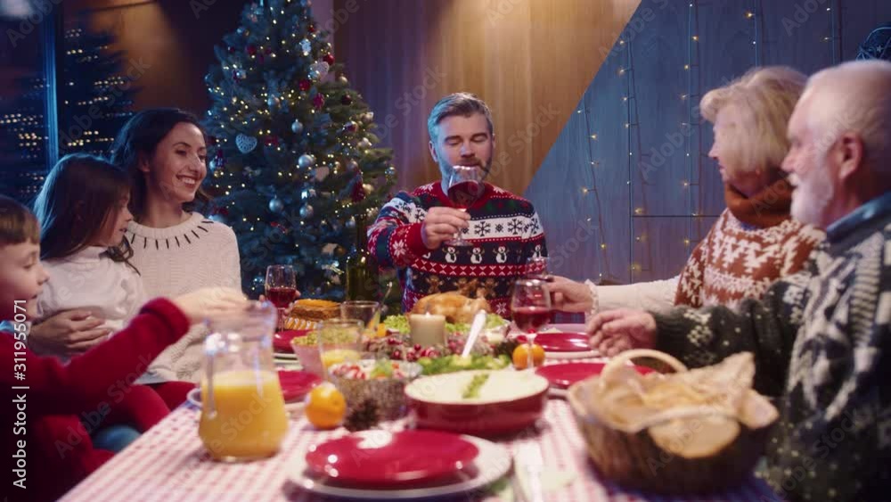 During Christmas, happy family members gathering together, preparing drinks and food, talking and spending wonderful feast holiday at home. During Christmas, happy family members gathering together, preparing drinks and food, talking and spending wonderful feast holiday at home.