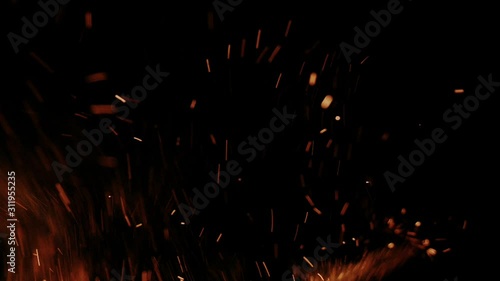 Hot flying embers and sparks in slow motion photo