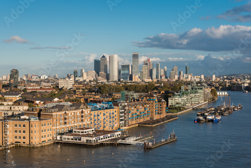 View of Residential Buildings in Front of Thames River and Canary Wharf District in the Horizon  in London  UK