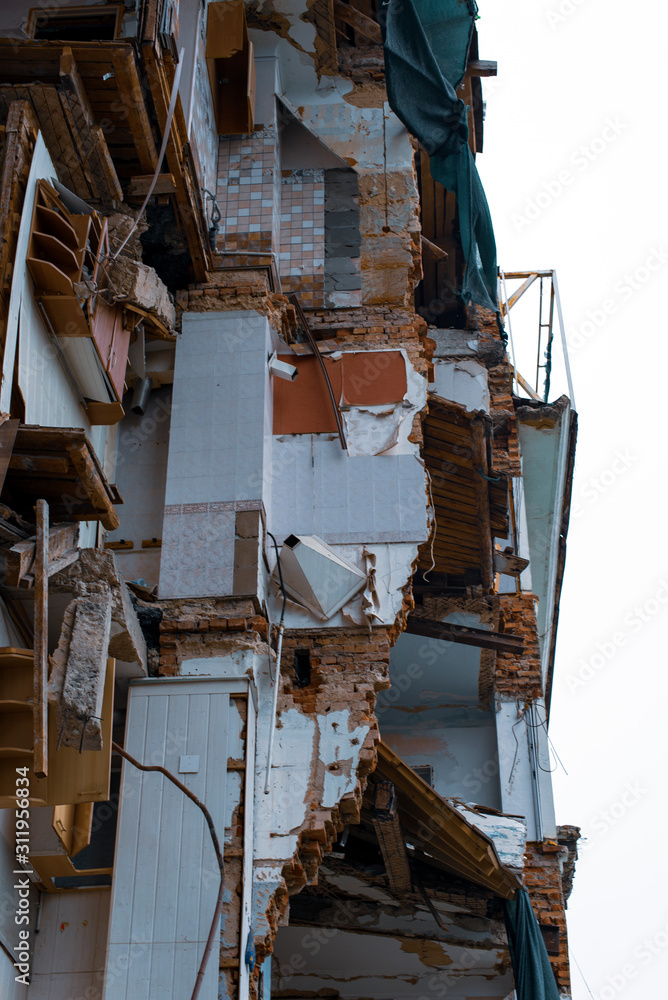 Destroyed multi-storey building in the context, part of the interior decoration, abandoned apartments.