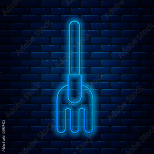 Glowing neon line Garden rake icon isolated on brick wall background. Tool for horticulture, agriculture, farming. Ground cultivator. Housekeeping equipment. Vector Illustration