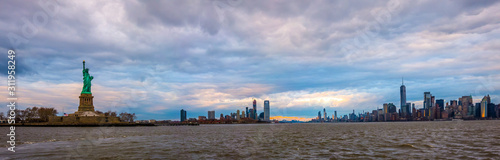 New York City Manhattan skyline panorama and cityscape from Hudson with Liberty Statue