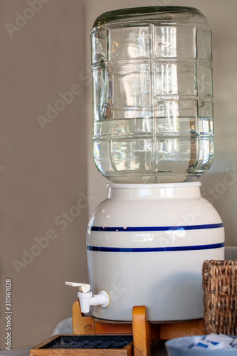 Ceramic Bottled Water Container Sitting on a Table