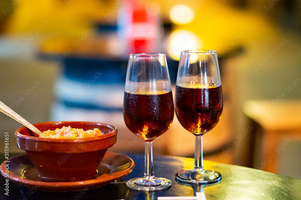 Naklejka premium Sherry wine tasting, selection of different jerez fortified wines from dry to very sweet in glasses, Jerez de la Frontera, Andalusia, Spain