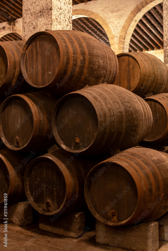 Production of fortified jerez, xeres, sherry wines in old oak barrels in sherry triangle, Jerez la Frontera, El Puerto Santa Maria and Sanlucar Barrameda Andalusia, Spain
