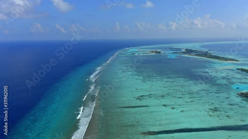 Aerial view, flight over the outer reef with Corals of the South Male Atoll Maldives photo