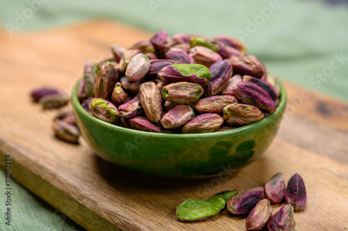 Obraz na plátně High quality green pistachio nuts growing on slopes of Mount Etna in Bronte, Sic