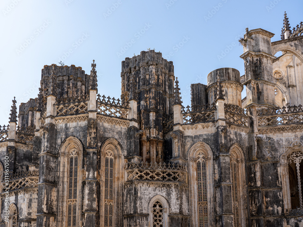 Exterior of the gothic stone structure of the unfinished section of Batalha Monastery near Leiria in Portugal