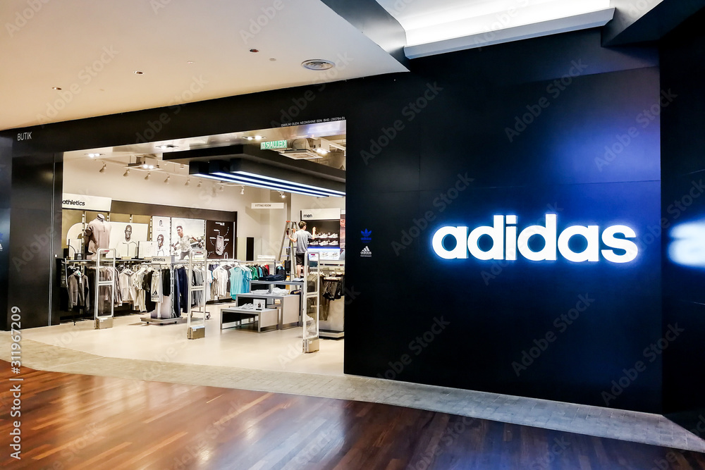 Especificidad Objetivo Bosque Adidas AG is a German multinational corporation, headquartered in  Herzogenaurach, Germany, that designs and manufactures shoes, clothing and  accessories. foto de Stock | Adobe Stock