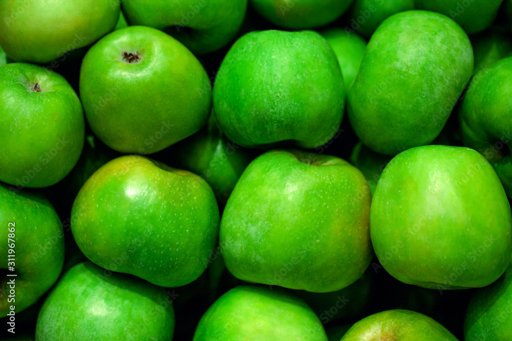 Green apples at market store background Green apples at market store background
