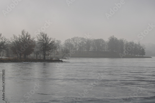 Foggy morning on a frozen lake