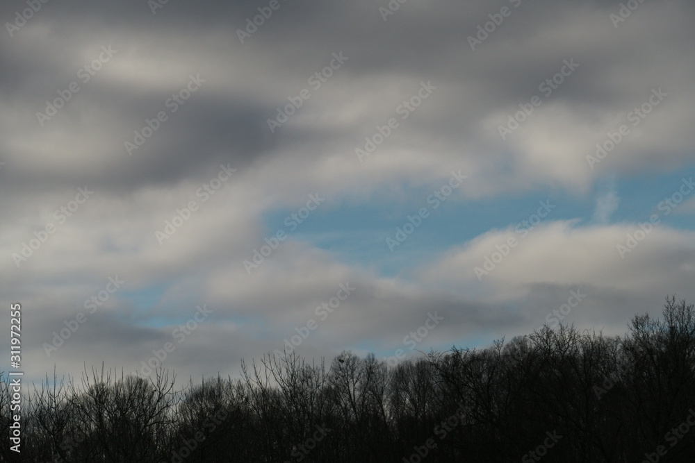 December--blue sky thru gray clouds