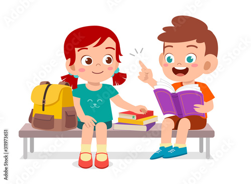 happy cute kids boy and girl read book together