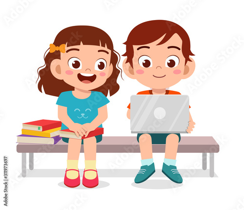 happy cute kids boy and girl read book together
