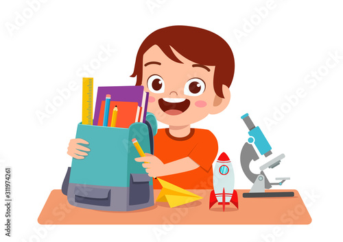 happy cute kid boy study on cute table