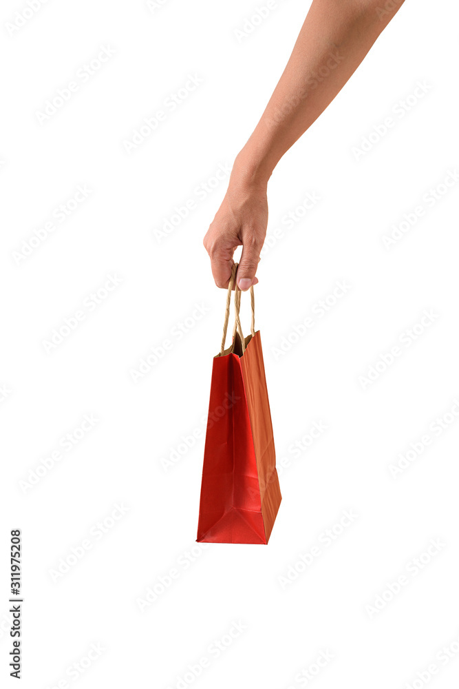 Female hand holding red papaer shopping bags