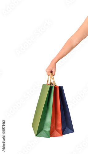 Female hand holding blank colorful papaer shopping bags