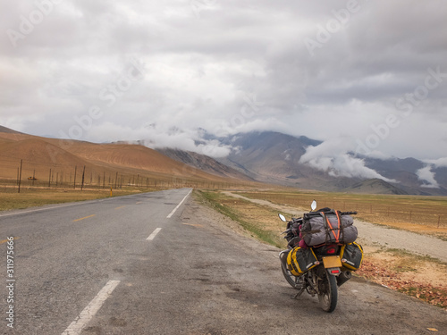 Traveling motorcycle with luggage in stormy weather © Mo