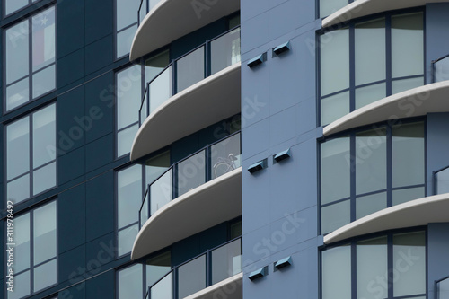 Close-up view of a blue apartment complex