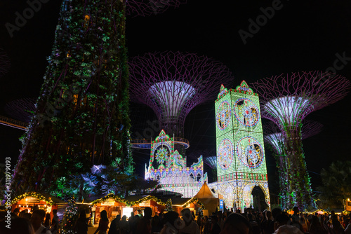 Lighting and music show with supertree of Christmas Wonderland Festival at Gardens by the Bay in Singapore. Popular tourist attraction in marina bay area. photo