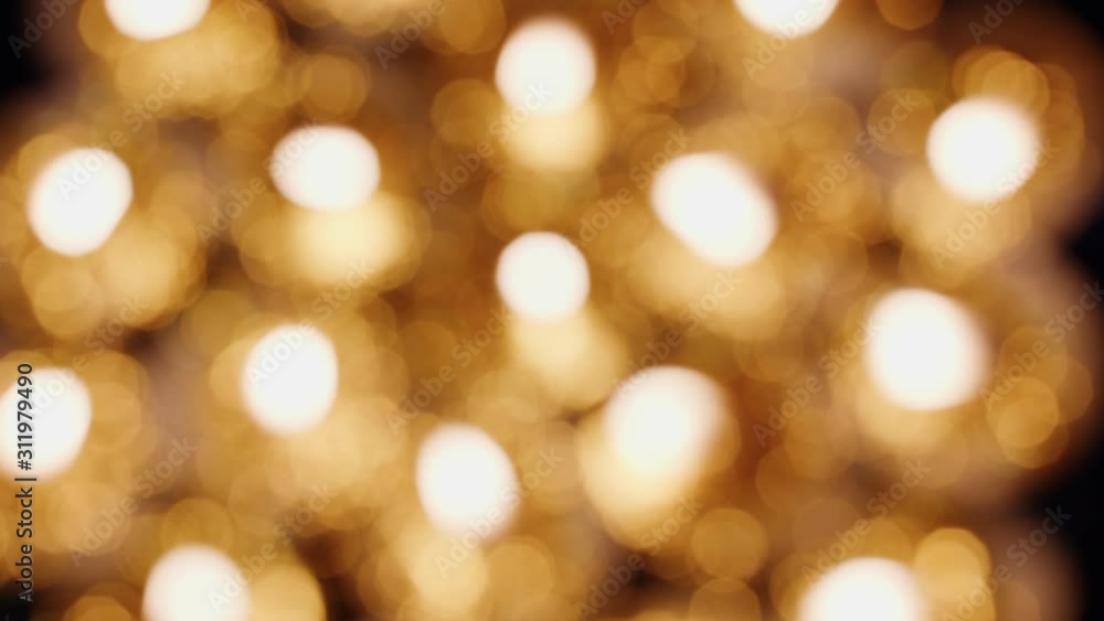 Burning Blurred background of tea cup Candles Lights shines yellow gold bright for celebration, religion, anniversary Festival. Candle spins rotates around and moving by wind, top view Burning Blurred background of tea cup Candles Lights shines yellow gold bright for celebration, religion, anniversary Festival. Candle spins rotates around and moving by wind, top view