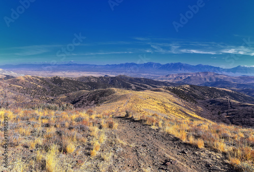 Views of Wasatch Front Rocky Mountains from the Oquirrh Mountains with fall leaves, Hiking in Yellow Fork trail and Rose Canyon in Great Salt Lake Valley. Utah, United States. USA.