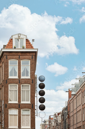 Photography Closeup shot of buildings in amsterdam with a empty signboard