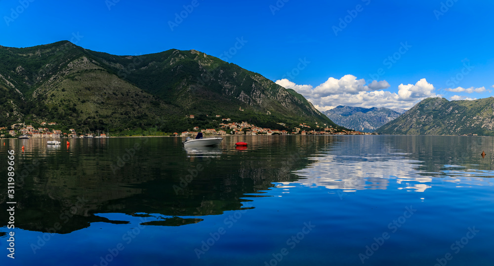 Panorama of Kotor Bay or Boka Kotorska, mountains reflecting in clear water, Balkans, Montenegro on the Adriatic Sea