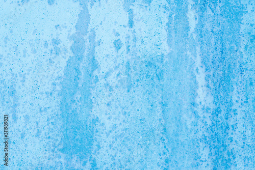 Non-uniform blue paint background on metal surface © Sunshine