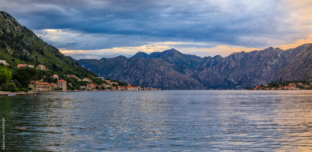 Panorama of Kotor Bay or Boka Kotorska with mountains, clear water at sunset, the Balkans Montenegro on the Adriatic Sea