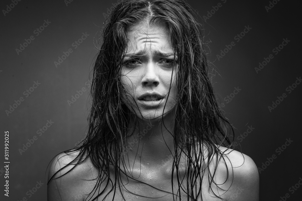 Expressive black white portrait of a young attractive girl with wet dark hair - obrazy, fototapety, plakaty 