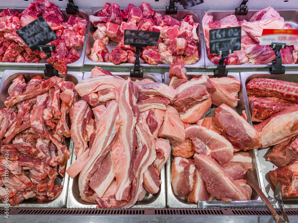 Belly pork and pork chop for sale at butcher stall