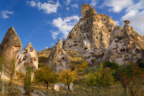 Fairy chimneys and ancient Uchisar Castle carved out of volcanic tuff Cappadocia Turkey