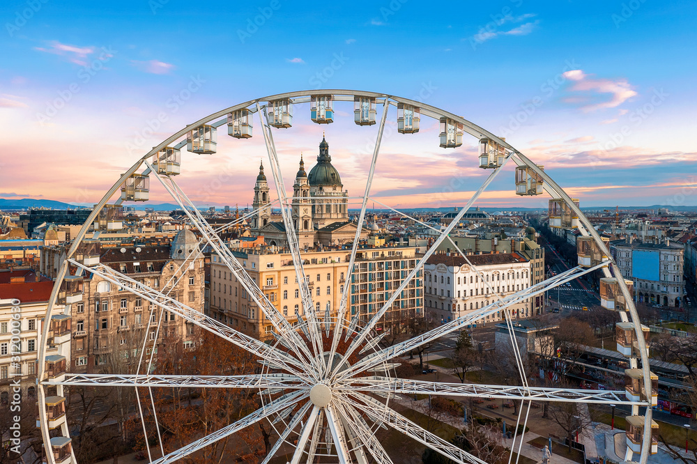 Fototapeta premium Europe, Hungary, Budaopest. Ferris wheel In Hungary Budapest. Erzsebet square, St Stephen Basilica, Andrassy street. Budapest Eye