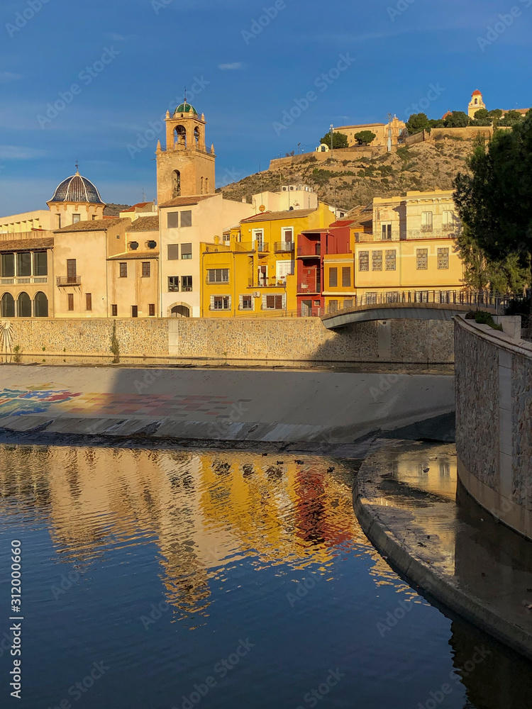 View across the Segura river to the old quarter of Orihuela. On the other side  the Episcopal Palace dome and the cathedral's bell tower, Orihuela, Costa Blanca, Alicante province, Spain