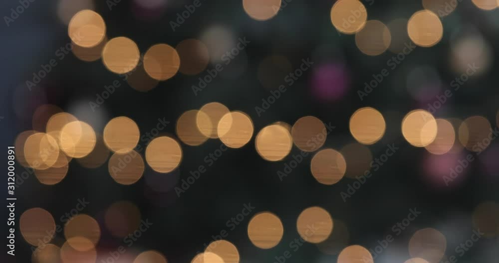Abstract isolated blurred festive yellow orange lights with bokeh. Holiday concept backdrop with twinkling bright shapes. Blinking Christmas Tree lights. Abstract isolated blurred festive yellow orange lights with bokeh. Holiday concept backdrop with twinkling bright shapes. Blinking Christmas Tree lights.