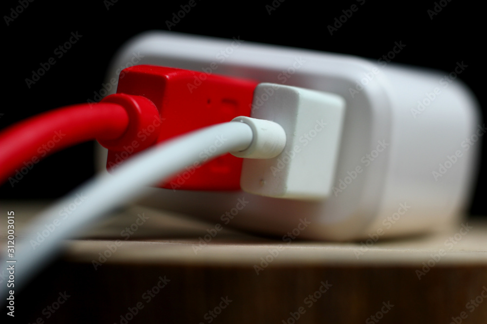 charger with colored wires on a dark background charger with colored wires on a dark background
