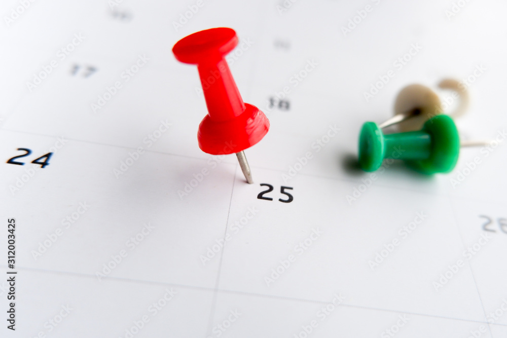 Thumbtack a date on calendar concept for important date, meeting reminder, planning for business, travel planning concept Thumbtack a date on calendar concept for important date, meeting reminder, planning for business, travel planning concept