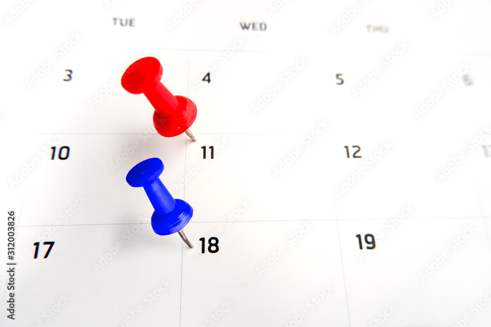 Thumbtack a date on calendar concept for important date, meeting reminder, planning for business, travel planning concept Thumbtack a date on calendar concept for important date, meeting reminder, planning for business, travel planning concept