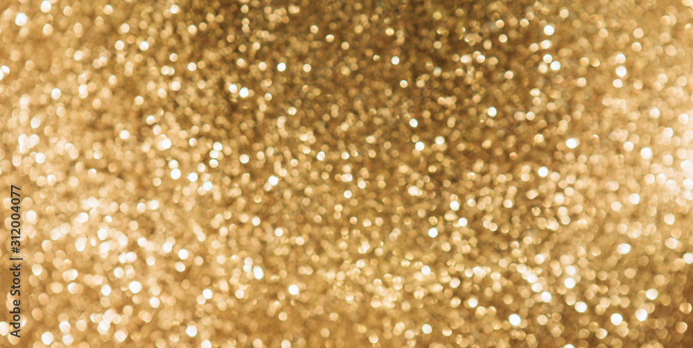 Golden blurred sparkles glowing background Golden blurred sparkles glowing background