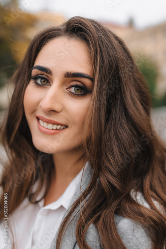 Young girl with professional makeup and hairstyle