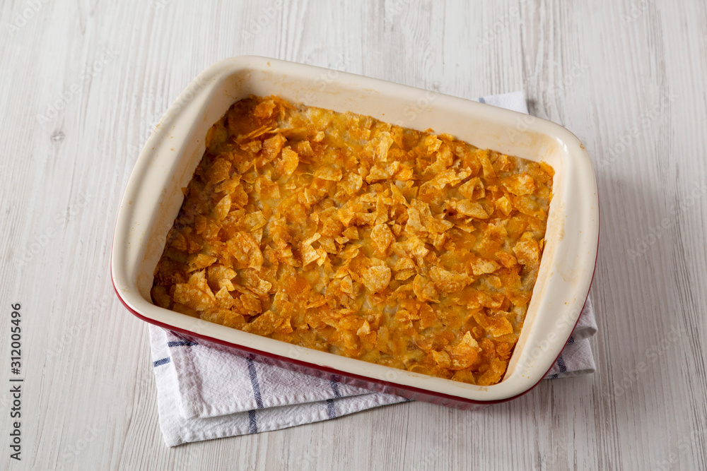 Homemade Funeral Potatoes Casserole in a dish, low angle view. Homemade Funeral Potatoes Casserole in a dish, low angle view.