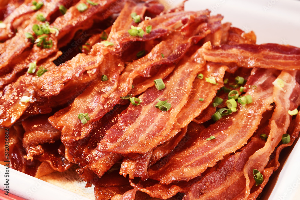 Crispy hot fried bacon in buffet corner , close up Crispy hot fried bacon in buffet corner , close up