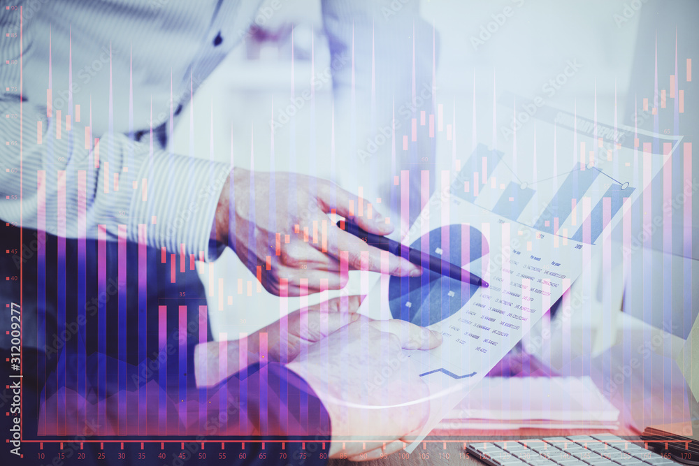 Financial trading graph double exposure with man desktop background. Financial trading graph double exposure with man desktop background.