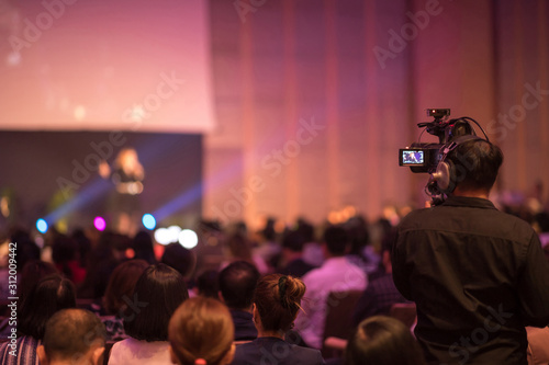 Photographer video recording activity, Video cameras is recording a video at a seminar in the hotel