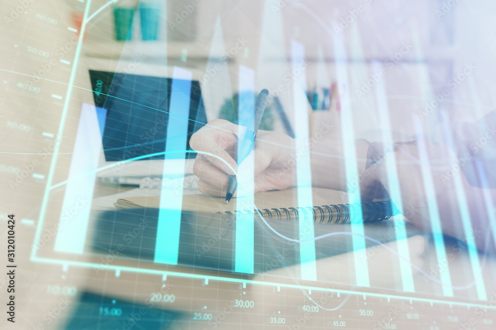 Financial graph displayed on woman's hand taking notes background. Concept of research. Double exposure Financial graph displayed on woman's hand taking notes background. Concept of research. Double exposure
