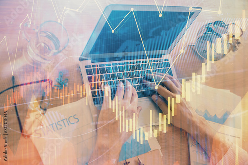 Multi exposure of forex graph with man working on computer on background. Concept of market analysis. © peshkova