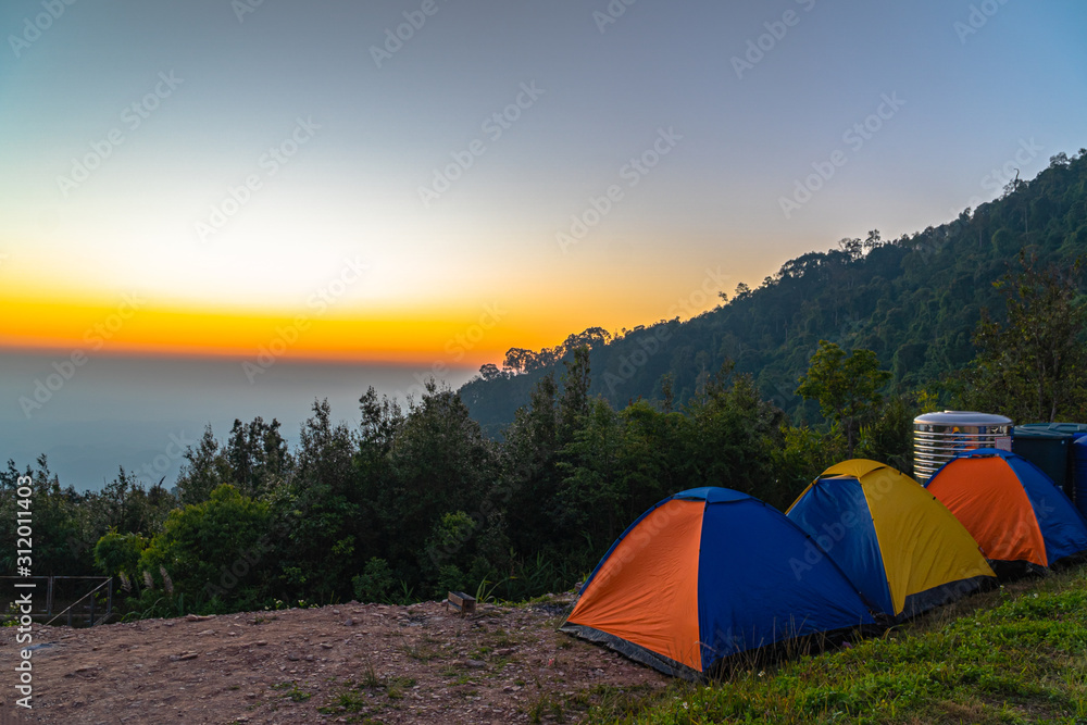 sunrise above camping on the top of mountain of  Khun Sathan Nation Park Nan province Thailand.