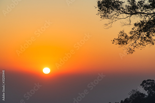 golden sunrise above the mountain range on Khun Sathan Nation Park © Narong Niemhom