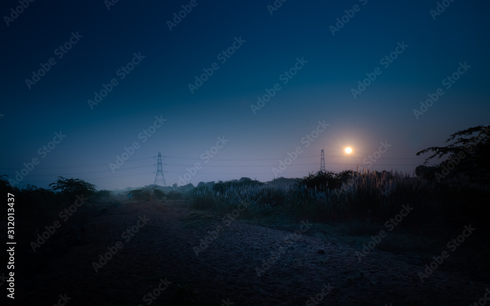sunset in city of jeddah at night with moon and stars